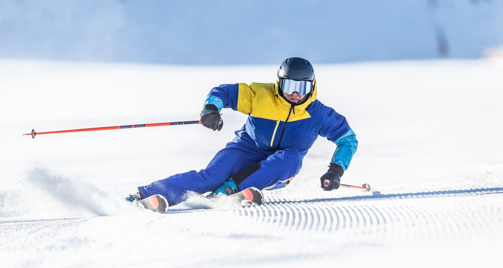 Thredbo 1380 Luxury Accomodation in Thredbo NSW, Australia A Young Aggressive Skier On An Alpine Slope Demonstrates An Extreme Carving Skiing Style.